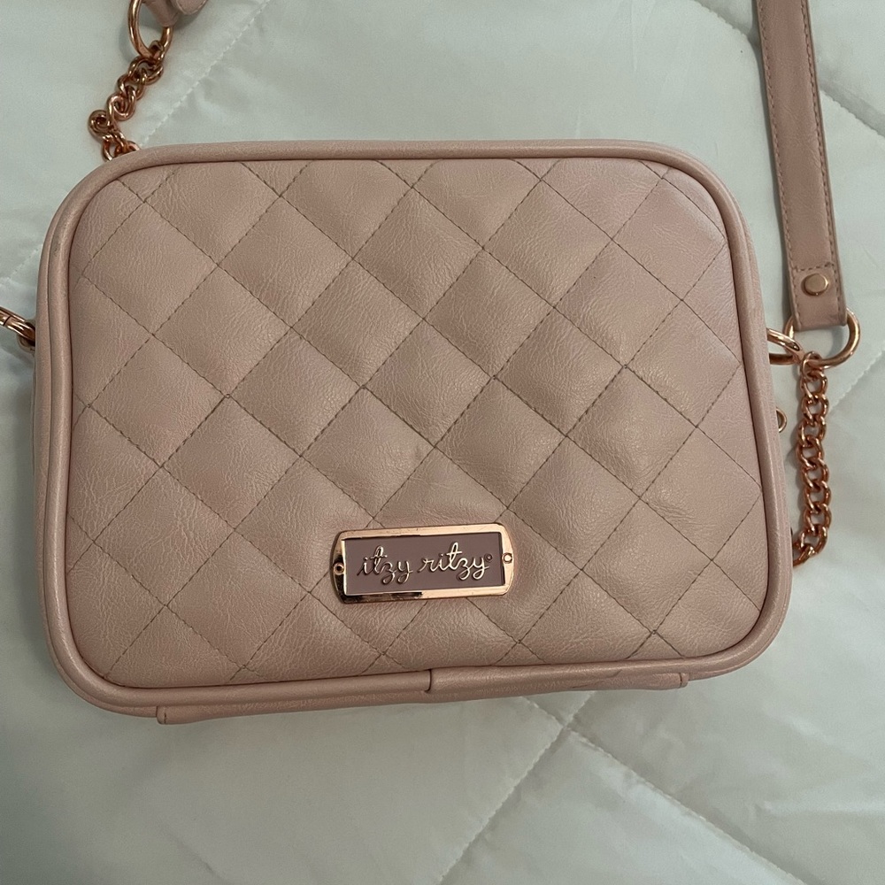 Itsy Ritsy crossbody mini diaper bag.